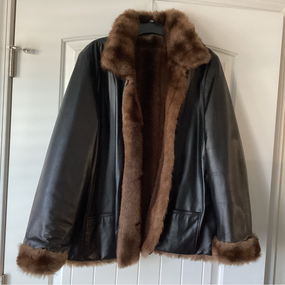 Womens Blushe Impressions reversible black genuine leather jacket.